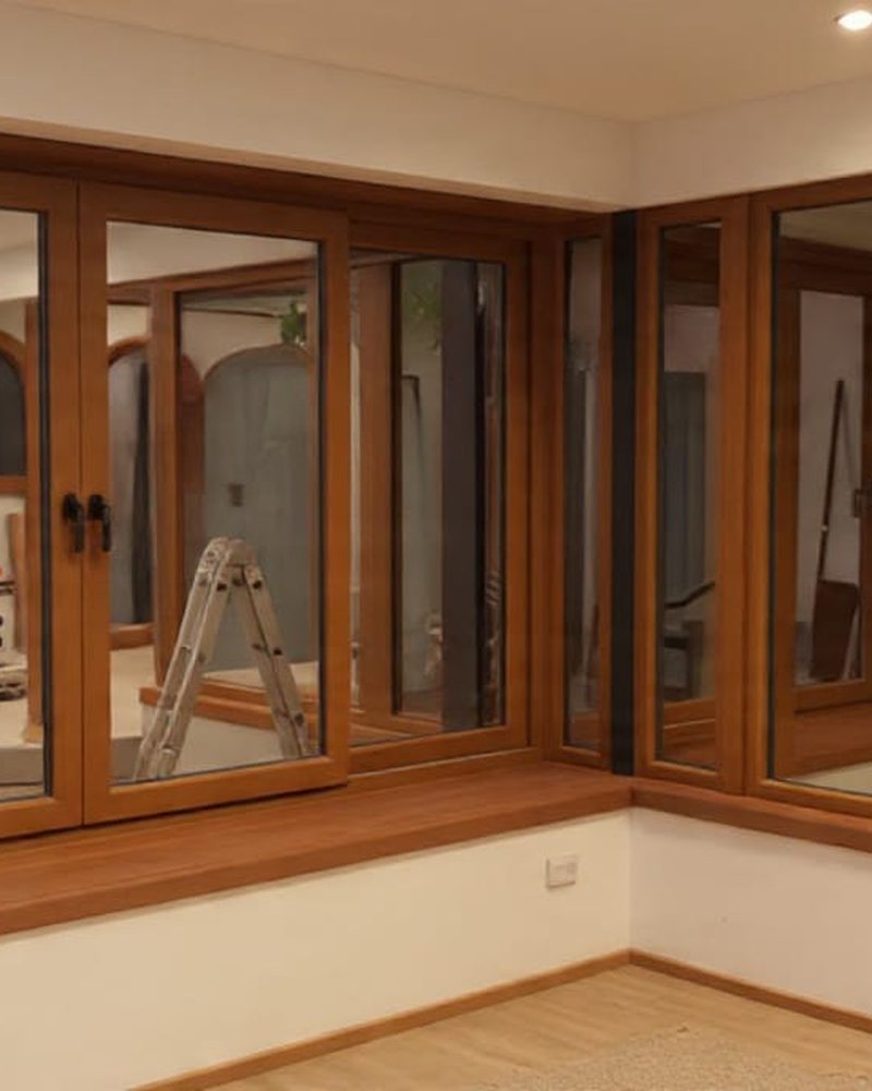 Ventanales esquineros de PVC color madera en living moderno
